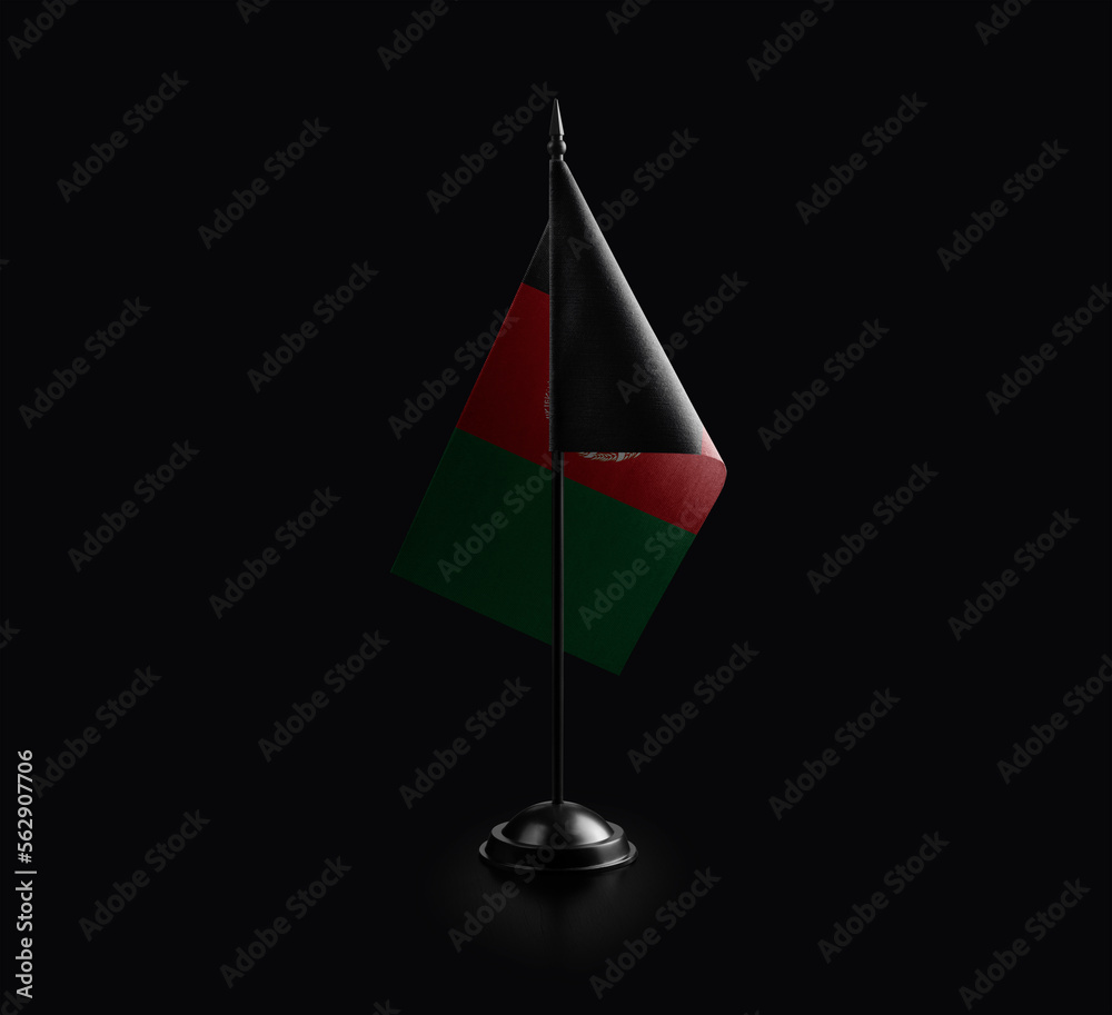Small national flag of the Afghanistan on a black background Small national flag of the Afghanistan on a black background