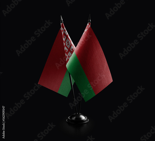 Small national flags of the Belarus on a black background photo