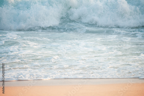 Obraz na płótnie (Selective focus) Stunning view of some ocean waves breaking on the shore during a beautiful sunset. Crushing waves, ocean waves relaxation. Bali, Indonesia. w salonie
