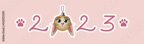 vector inscription 2023 in pink tones with a Christmas ball instead of zero in the form of a rabbit