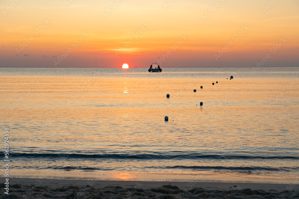 Colorful sky and the sea at dawn. The rising sun is in the background Colorful sky and the sea at dawn. The rising sun is in the background