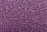 Full frame macro abstract background of sparkling purple glitter texture surface 