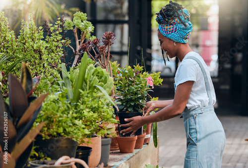 Business owner, black woman and plant shop for garden, nursery or greenhouse retail. Entrepreneur working in green startup store or market for sustainability, environment and gardening growth outdoor