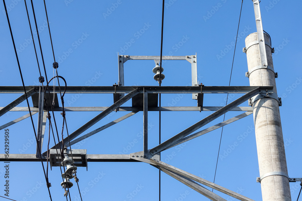 power lines on blue sky. electric poles, hanging power lines. against a blue sky background. with the morning sun.
power lines on blue sky. electric poles, hanging power lines. against a blue sky background. with the morning sun.