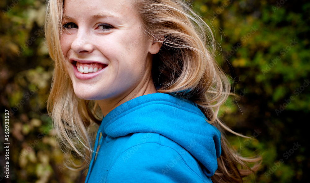 A female hiker smiles.
