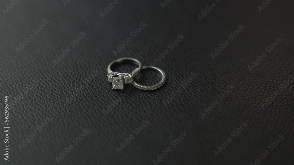 Close up, slow motion shot of bride's wedding ring and engagement ring. Bride's Jewelry. Shot in 4K 60 FPS. To purchase entire event raw at wholesale price email willneatheryyahoo.com. Close up, slow motion shot of bride's wedding ring and engagement ring. Bride's Jewelry. Shot in 4K 60 FPS. To purchase entire event raw at wholesale price email willneatheryyahoo.com.