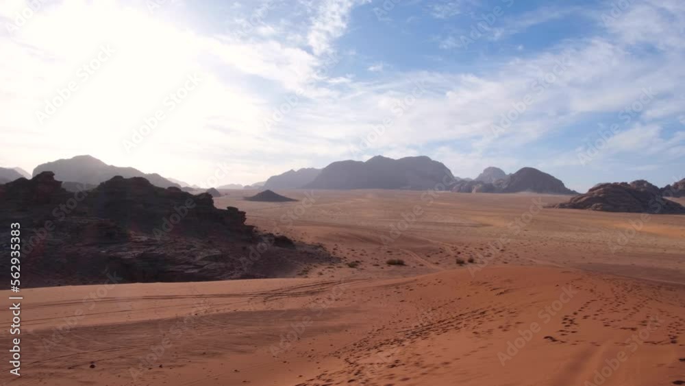 Remote wilderness of red sand desert and mountainous landscape in Wadi Rum on the Saudi Arabia border in Jordan, Middle East Remote wilderness of red sand desert and mountainous landscape in Wadi Rum on the Saudi Arabia border in Jordan, Middle East