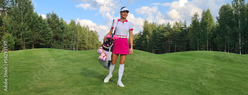 Obraz na plátně Beautiful golfer with bag on gof course