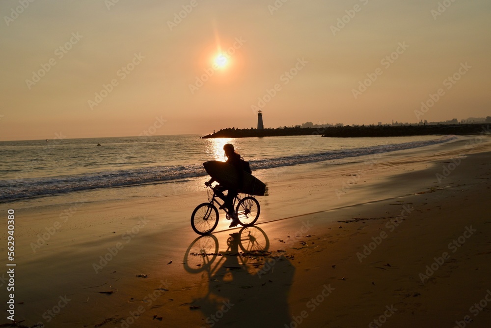 Fototapeta premium Sunset Bike Ride on the Beach 