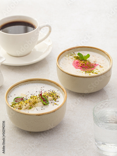 Side view on two different cereal porridge bowls