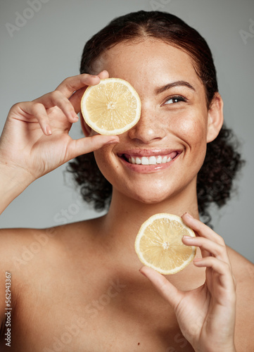 Foto Face, skincare and woman with lemon in studio isolated on a gray background