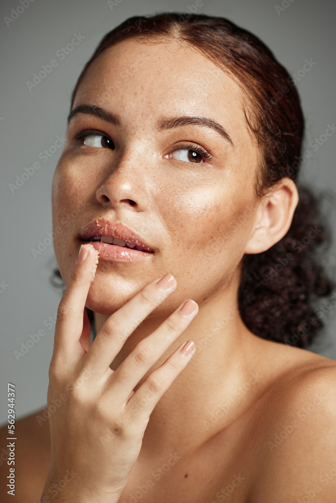 Sugar scrub, face and lips of woman in studio isolated on a gray