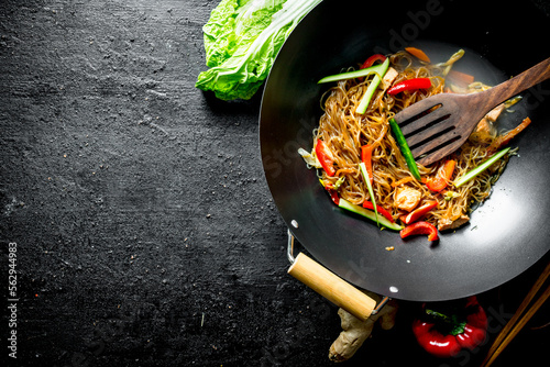 Fragrant Chinese funchoza with fresh vegetables. photo