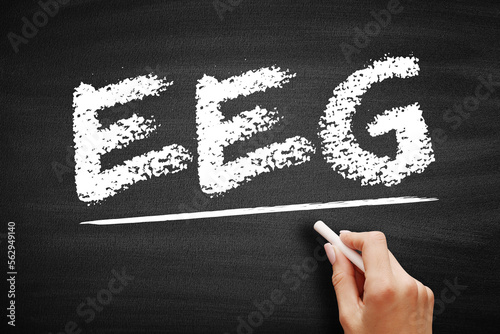 EEG Electroencephalogram - test that records the electrical signals of the brain by using small metal discs, acronym text on blackboard photo