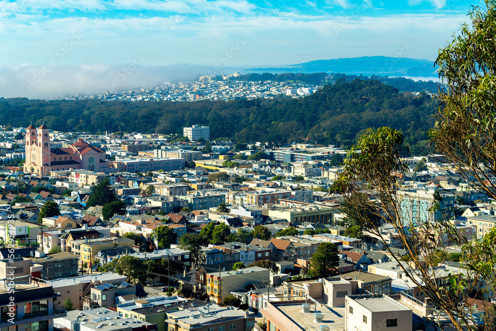 Cityscape of downtown historic districts of san francisco california in midday sun with distant fog on mountains