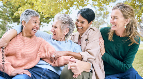 Happy senior women, laughing or bonding in nature park, grass garden or relax environment in retirement, support or trust. Smile, diversity or elderly friends in comic joke, funny meme or emoji face © J Maas/peopleimages.com