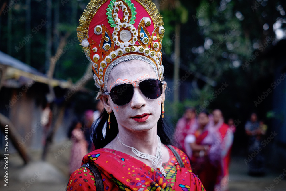 young aged man dressed like woman in traditional indian costume in