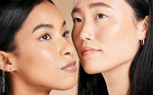 Face, beauty and diversity with model woman friends closeup in studio on a beige background. Skincare, facial or cosmetics with an attractive young female and friend posing to promote a skin product