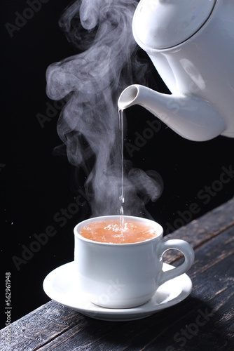Tea is an aromatic beverage prepared by pouring hot or boiling water over cured or fresh leaves of Camellia sinensis, an evergreen shrub native to East Asia which probably originated in the borderland
