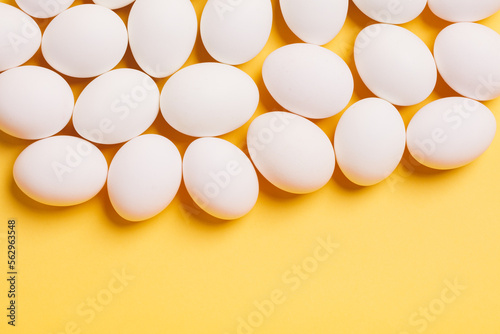 White eggs on yellow background
