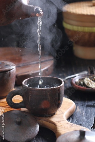 Obraz na plátne Tea is an aromatic beverage prepared by pouring hot or boiling water over cured