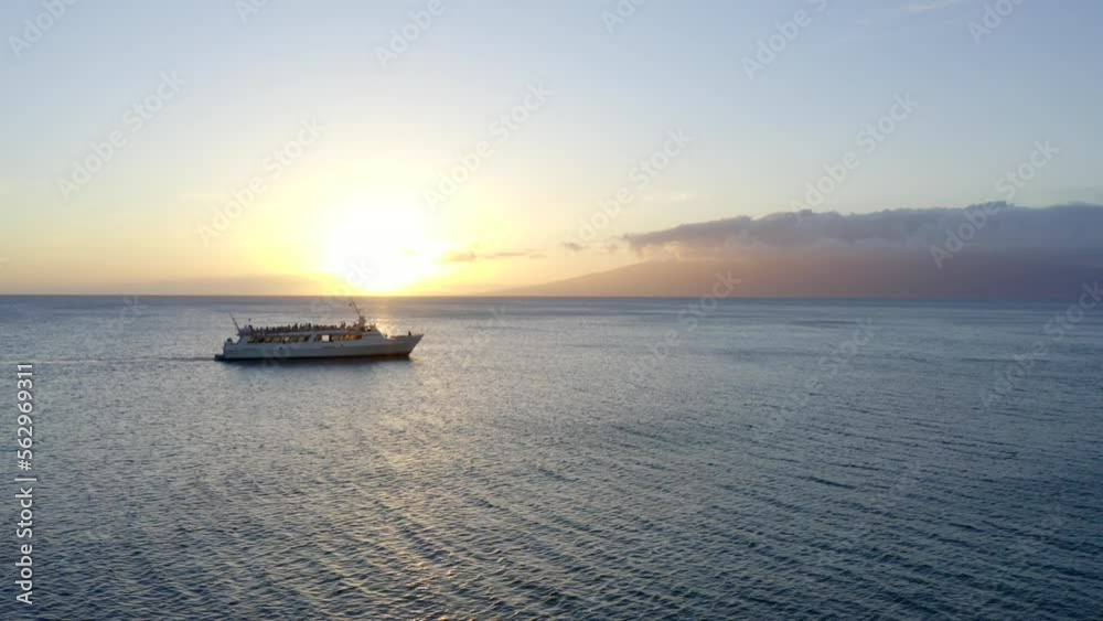 Tourist Ferry Boat on the Ocean in Maui Hawaii at Sunset