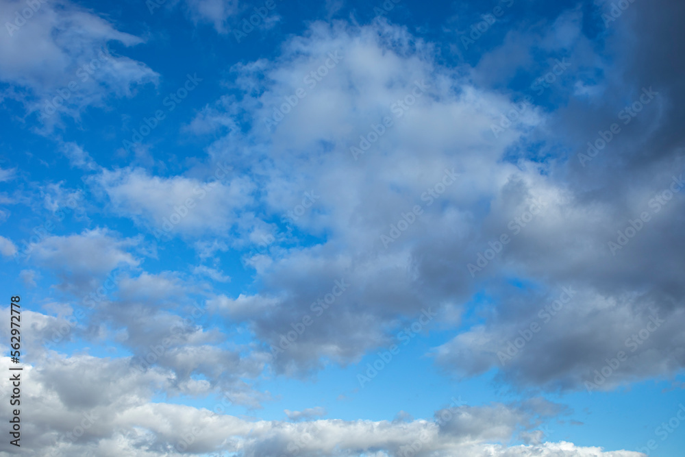 Detail of intense blue sky in broad daylight with fluffy white cumulus