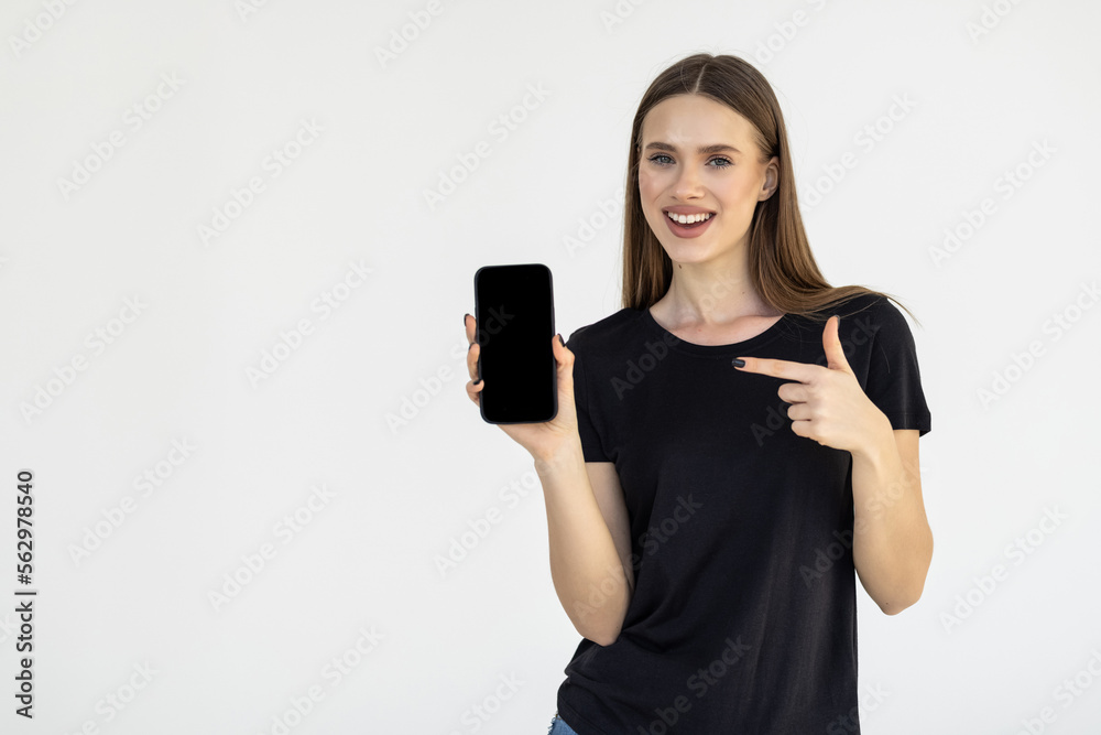 Portrait of a businesswoman showing blank screen mobile phone isolated over white background Portrait of a businesswoman showing blank screen mobile phone isolated over white background