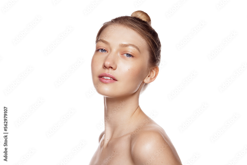 Well hydrated skin. Portrait of beautiful female model with healthy skin and natural blonde hair against white background. Well hydrated skin. Portrait of beautiful female model with healthy skin and natural blonde hair against white background.