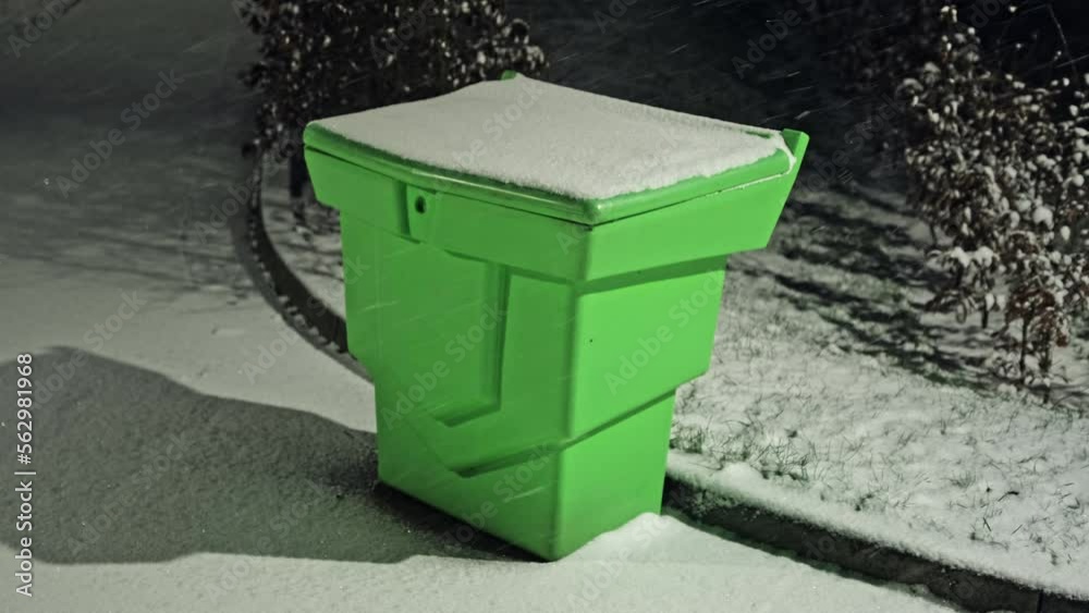 Sand Grit Box Covered in Snow during Night Winter Blizzard Sand Grit Box Covered in Snow during Night Winter Blizzard