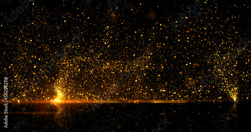 Abstract background. Golden rays of light with luminous magical dust. Gold Particles