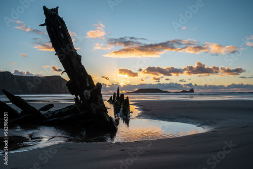 Wreck of the Helvetia, shipwreck on Rhossili beach at sunset, no people. Gower Peninsula, South Wales, the United Kingdom, UK GB. photo