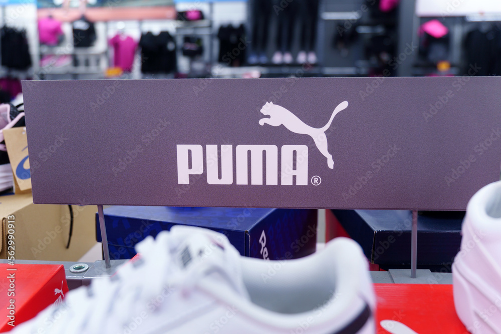 Tyumen, Russia-August 12, 2022: Puma logo in a sports wear store showroom.  Sport and casual footwear concept Stock Photo | Adobe Stock