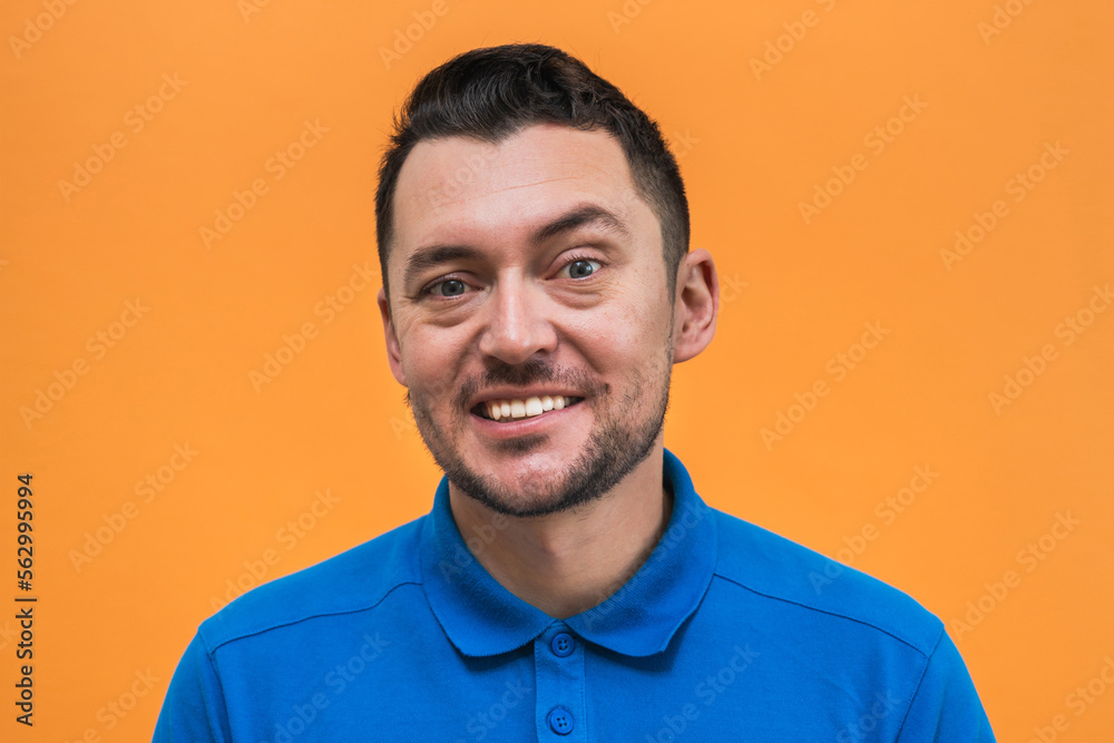 Fototapeta premium Portrait of the man on orange background. Man's emotions