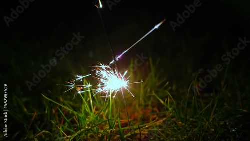 Fireworks Sparklers Stick Burning Casting Beautiful Sparkles on New Years Eve Night