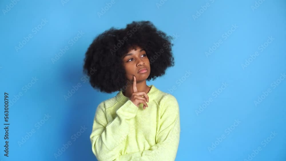 pensive Charming black woman on blue background pensive Charming black woman on blue background