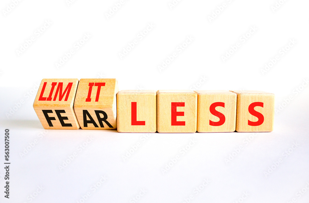 Fearless and limitless symbol. Concept word Fearless and limitless on wooden cubes. Beautiful white table white background. Business fearless and limitless concept. Copy space. Fearless and limitless symbol. Concept word Fearless and limitless on wooden cubes. Beautiful white table white background. Business fearless and limitless concept. Copy space.