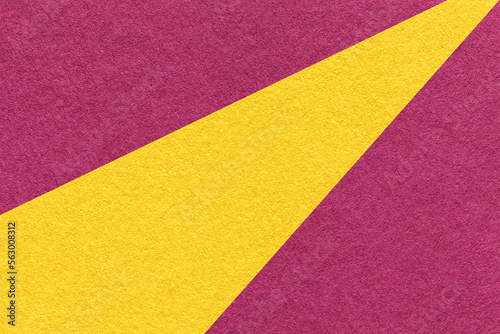 Texture of old craft purple and yellow color paper background, macro. Structure of vintage abstract magenta cardboard