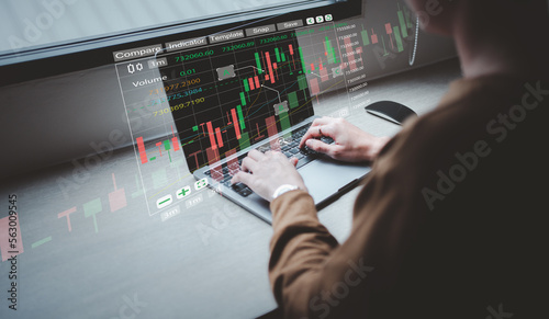 Woman using laptop or computer and trading graph financial data. Business finance background. Tablet and finance technology and investment concept. Stock Market Investments Funds and Digital Assets. 