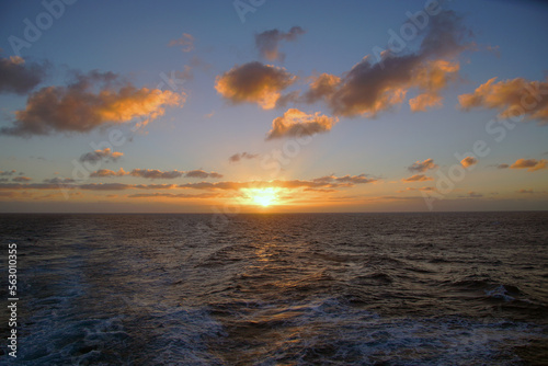 Magic of the Atlantic. Sunrise . Open ocean waves horizon and clouds. Bright colors. 