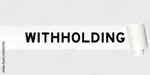 Ripped gray paper background that have word withholding under torn part