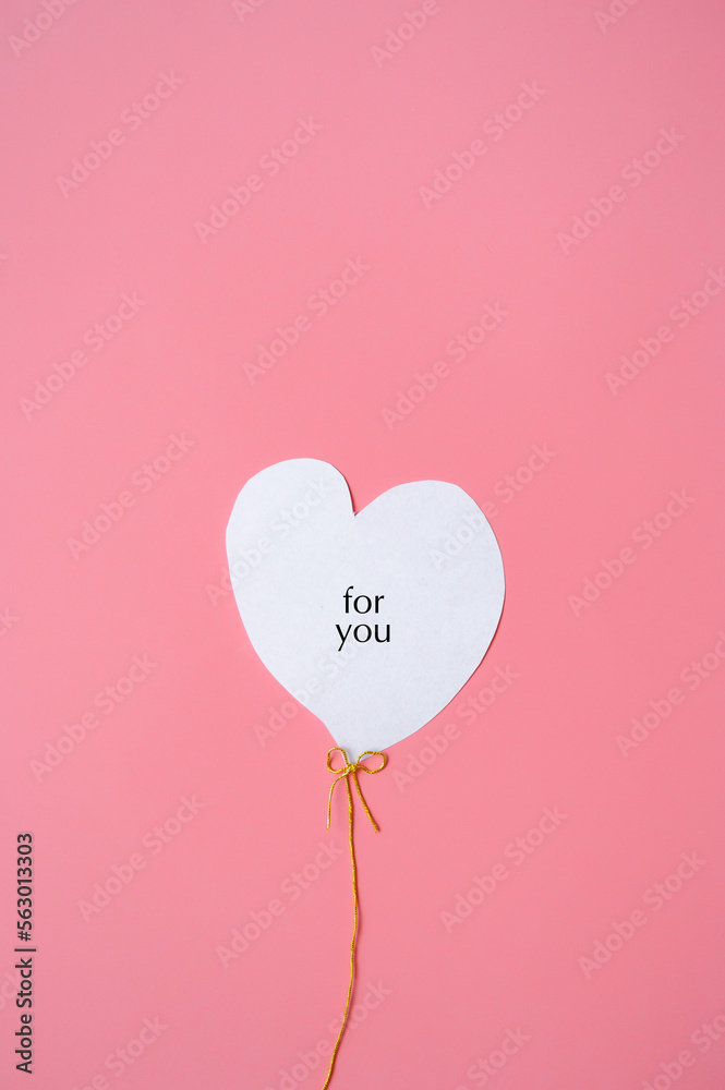 White heart on a pink background with the inscription 