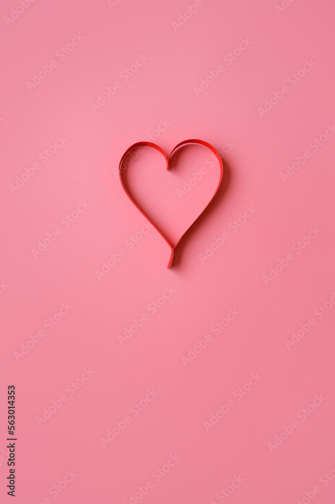 red heart made of paper on a pink background. Background for a valentine's postcard. valentine day. Love concept.