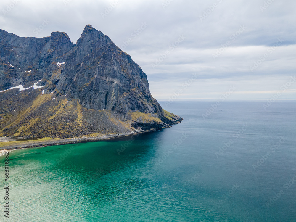 Aerial photographs of Kvalvika Beach in Lofoten, Norway, during spring on a clear day with clouds Aerial photographs of Kvalvika Beach in Lofoten, Norway, during spring on a clear day with clouds