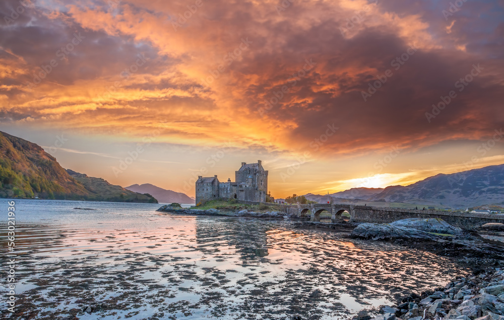 Colorful sunset against Eilean Donan Castle at Kyle of Lochalsh in the Western Highlands of Scotland