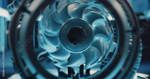 Close Up of a Rotating Fan Working Inside a High Tech Prototype Turbine Engine. Advanced Jet Engine Research and Development in a Factory Facility with Modern Equipment photo