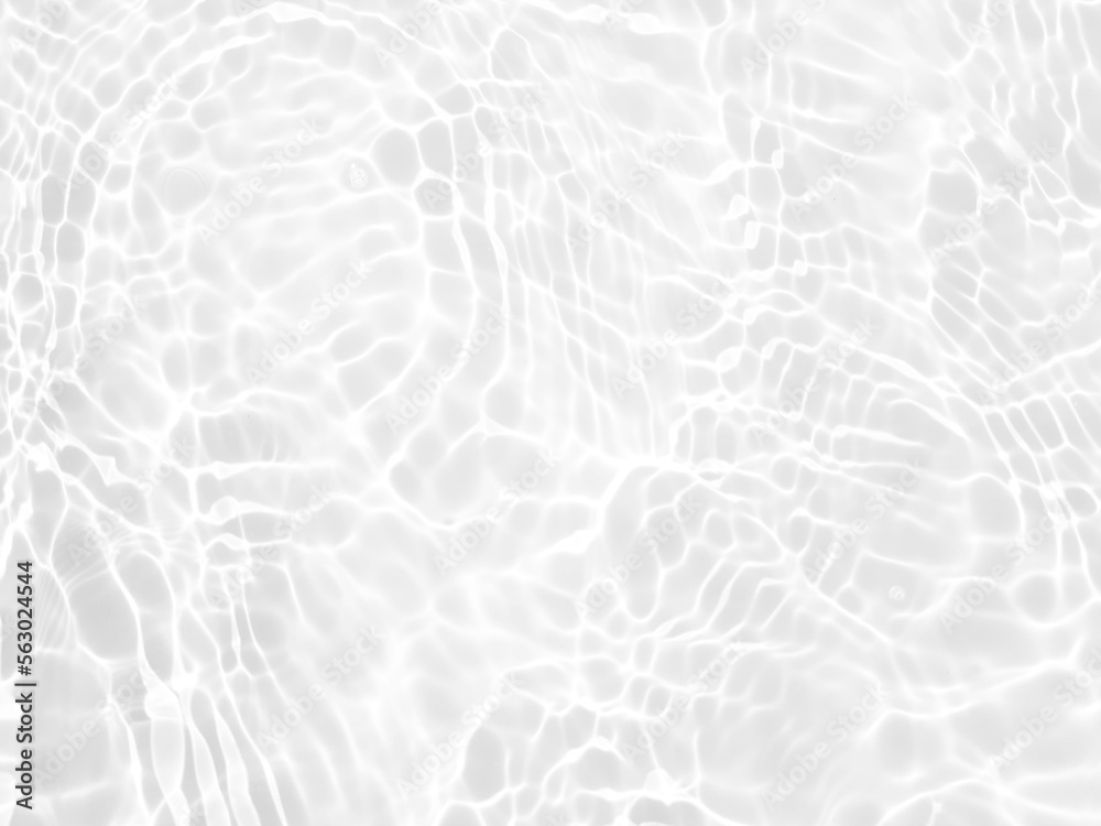 Defocus blurred transparent white colored clear calm water surface texture with splashes and bubbles. Trendy abstract nature background. Water waves in sunlight with copy space. White water shine