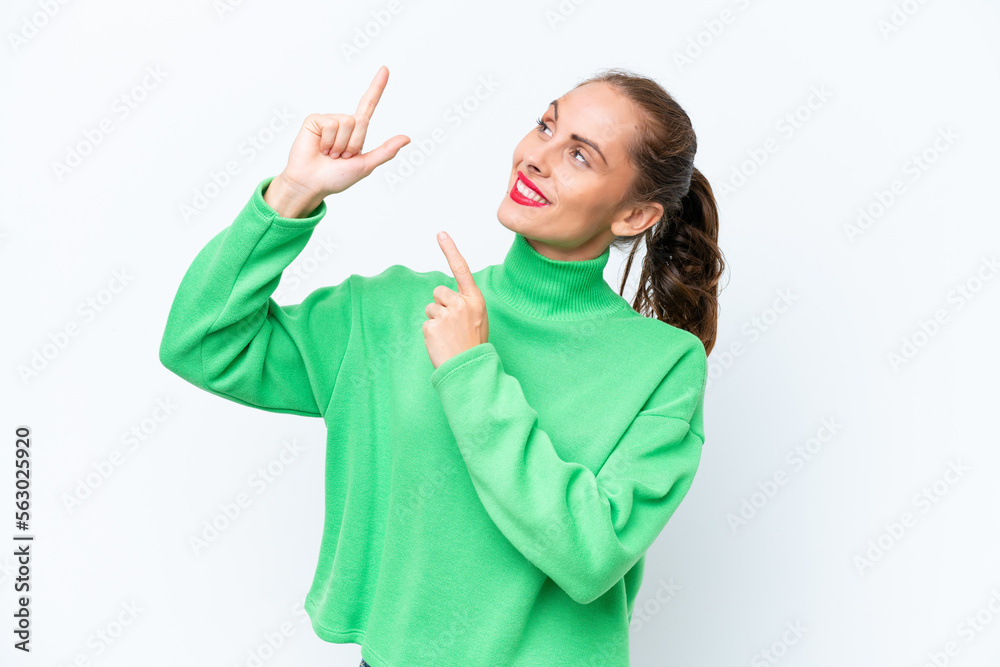 Young caucasian woman isolated on white background pointing with the index finger a great idea Young caucasian woman isolated on white background pointing with the index finger a great idea