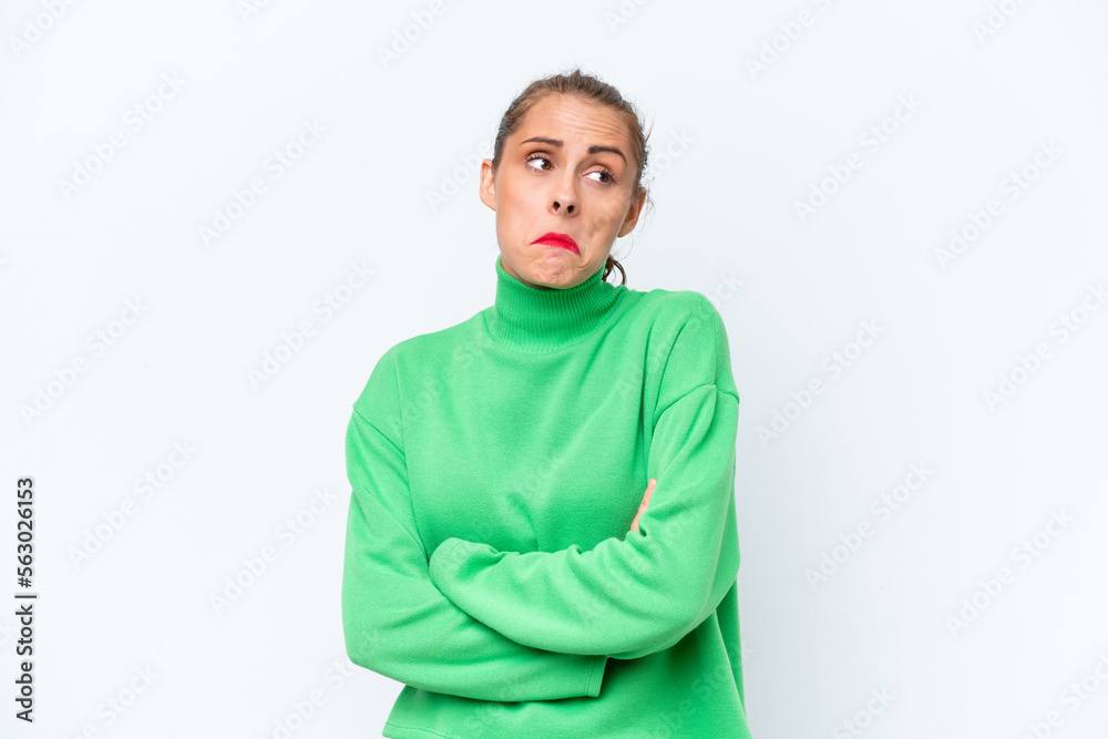 Obraz premium Young caucasian woman isolated on white background making doubts gesture while lifting the shoulders
