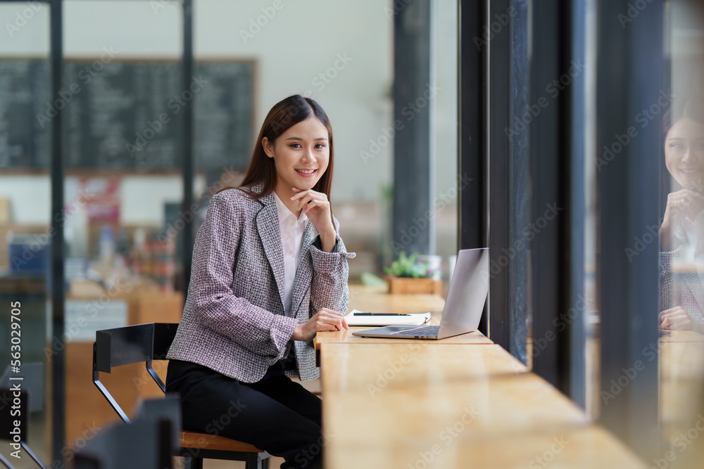 Business woman working at home office and analyze financial report document. Accounting and Finance concept Business woman working at home office and analyze financial report document. Accounting and Finance concept